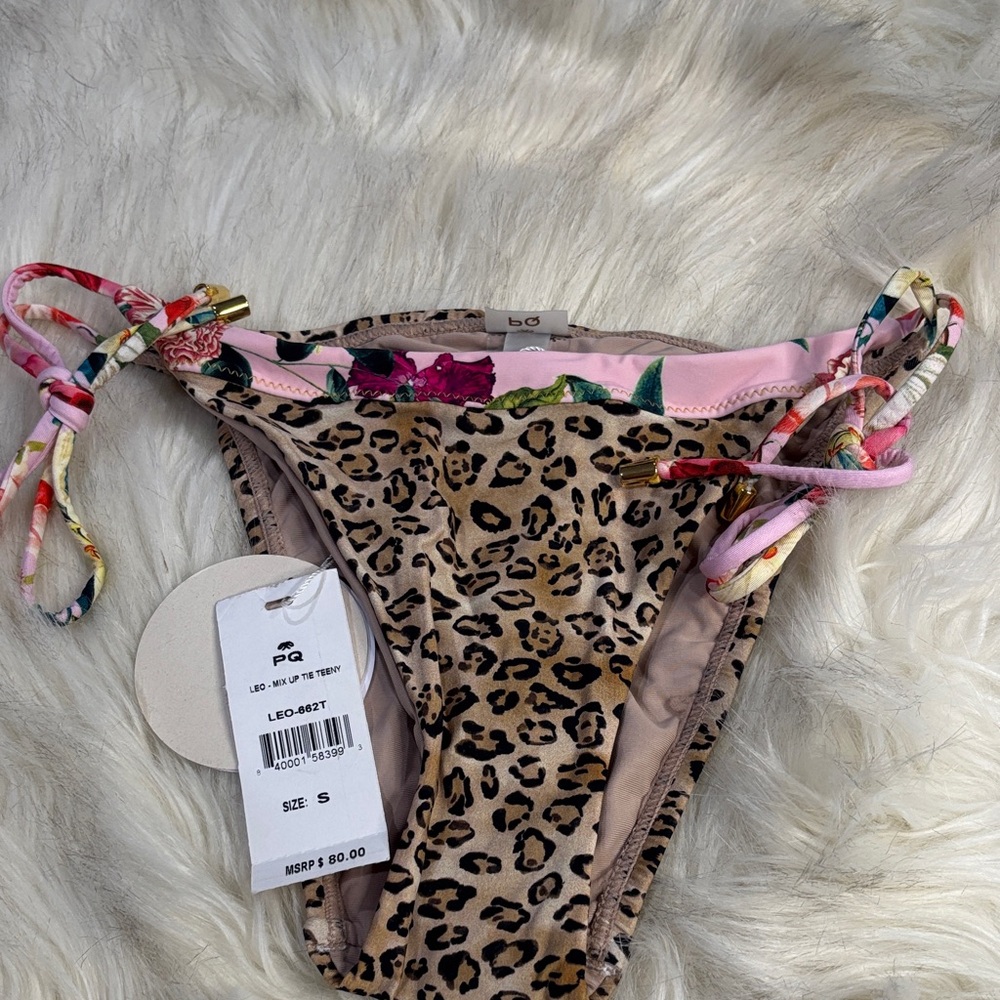 PQ Swim Leopard mix up Tie side Teeny 
With Floral trim accents
Size small